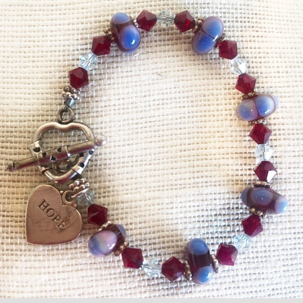 Silver bracelet w/ Swarovski and lamp work beads